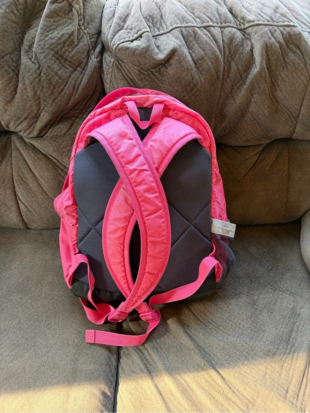 Pink and grey Nike backpack